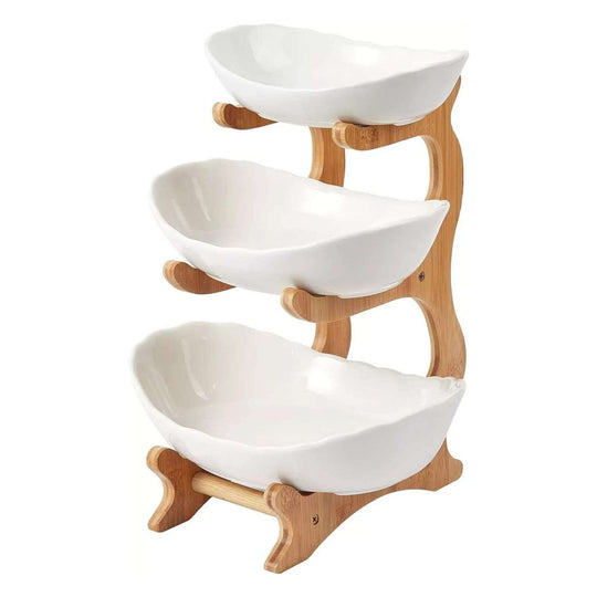 Three-tier porcelain fruit bowl with bamboo stand, perfect for stylish and space-saving serving of snacks and salads.