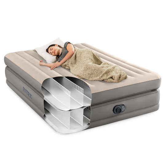 Woman sleeping comfortably on Intex Dura-Beam Plus Queen elevated air mattress, showcasing its luxurious design and durability.