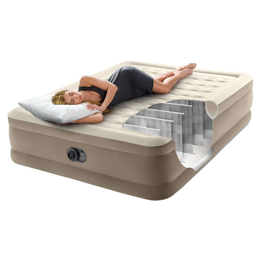 Woman relaxing on an Intex Dura-Beam Ultra Plush Air Mattress, showcasing its superior comfort and Fiber-Tech construction.