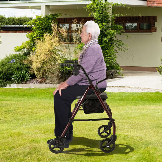 Elderly woman using Orthonica 4-wheel foldable rollator walker in a garden, promoting mobility and independence.