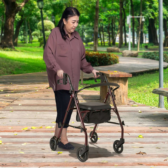 Senior woman using the Orthonica foldable steel frame rollator walker in a park, promoting mobility and independence.