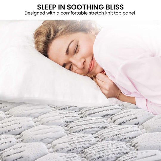 Woman enjoying restful sleep on the Laura Hill Essential mattress featuring a soft stretch knit top panel.