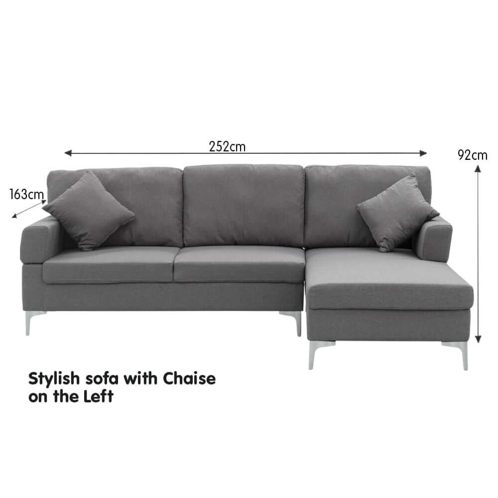 Sarantino 3 seater dark grey L-shaped sofa with left chaise, stylish design, with cushions and dimensions displayed.