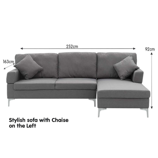 Sarantino 3 seater dark grey L-shaped sofa with left chaise, stylish design, with cushions and dimensions displayed.