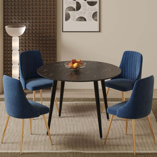 Blue Velvet Bistro Dining Set with black round marble-effect table and four blue velvet chairs in a modern dining room setting.