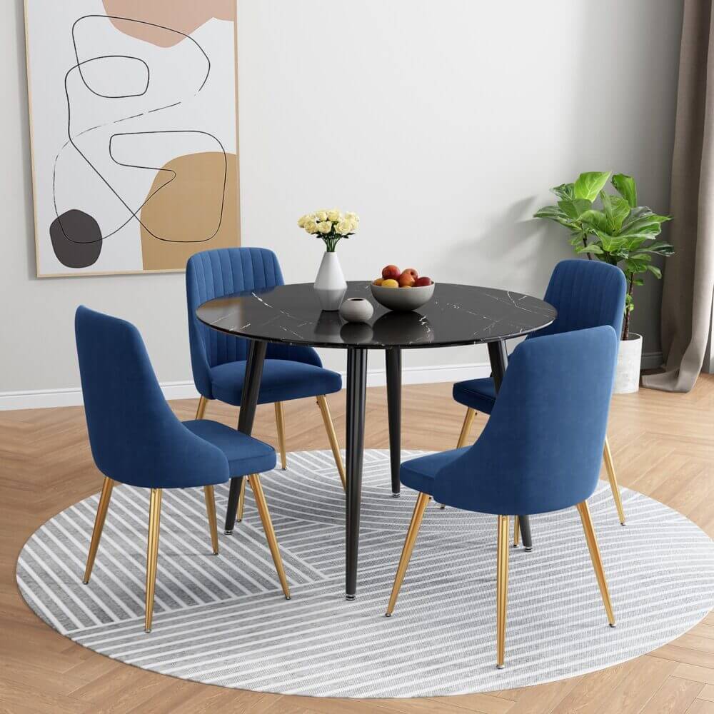 Blue Velvet Bistro Dining Set featuring four modern velvet chairs and a black round table with marble effect, perfect for a stylish dining environment