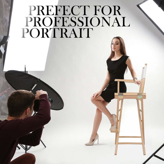 Model seated on beech wood director chair in studio, ideal for professional portraits and photography setups.