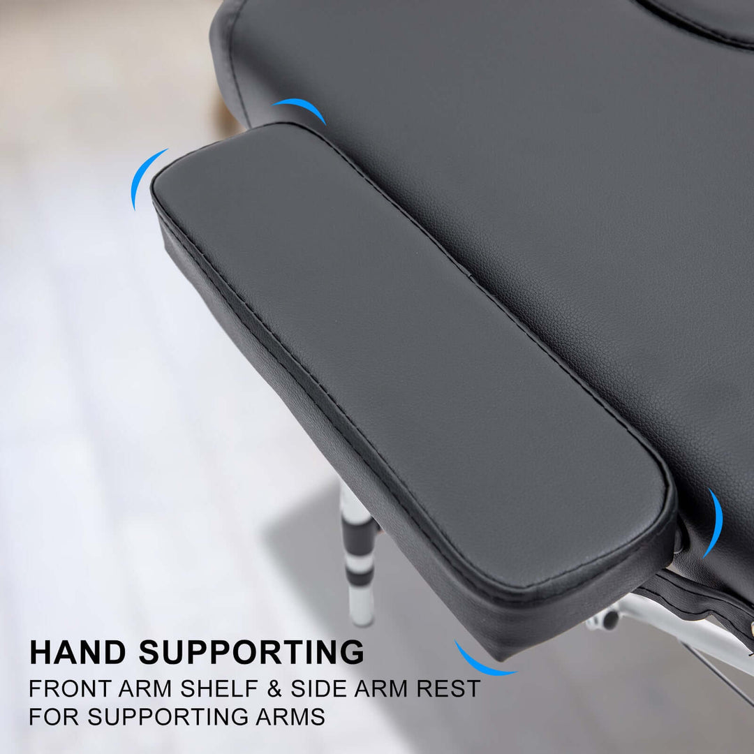 Hand supporting armrest on portable beauty massage table bed for enhanced comfort and stability.