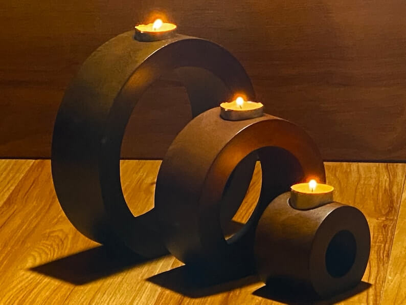 Set of 3 affordable wooden candle holders in concentric design, perfect for DIY decor and adding luxury to any home.