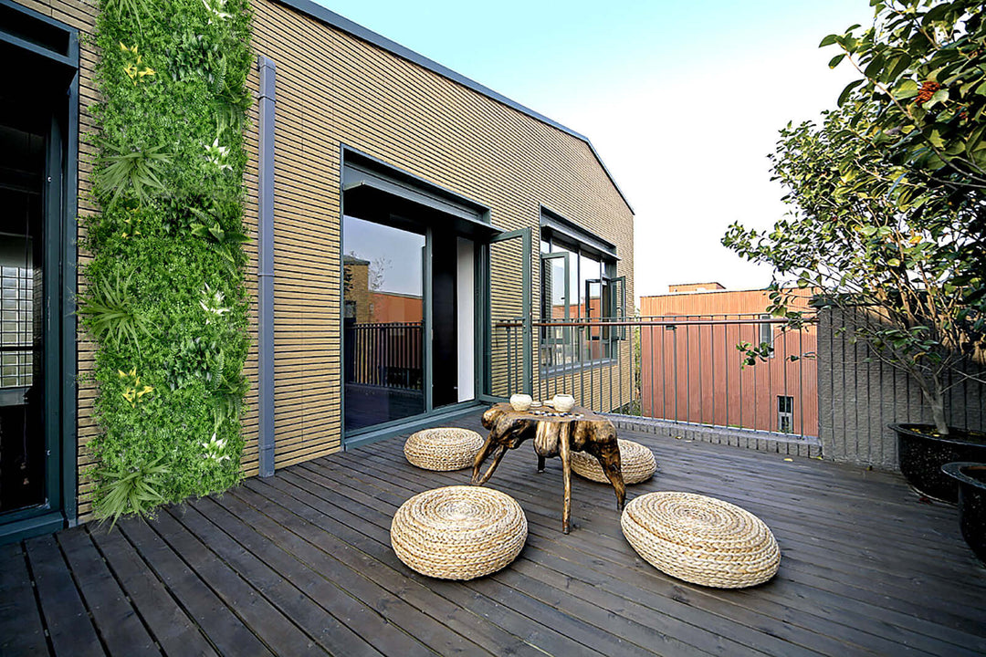 Modern balcony featuring YES4HOMES artificial plant wall grass panels, enhancing outdoor space with lush greenery.