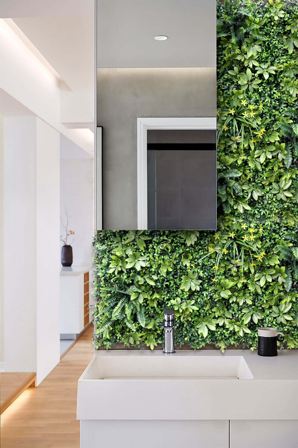 Lush green artificial plant wall panel in modern bathroom, enhancing decor with affordable, quality DIY design.