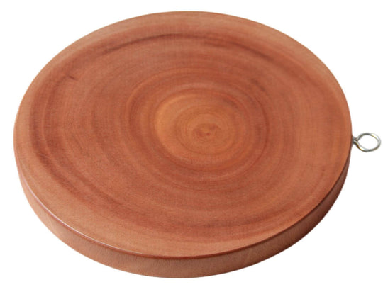 Round natural hardwood cutting board, hygienic and easy to clean, ideal for chopping and serving.