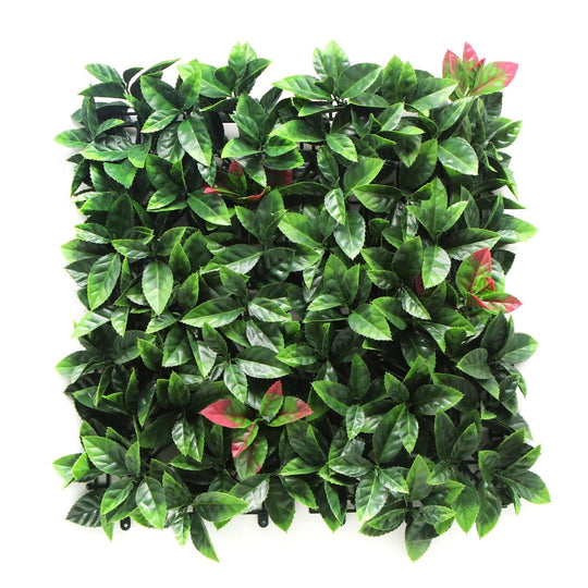 Lush green artificial plant wall panel with white flowers and burgundy accents, perfect for affordable DIY vertical gardens.