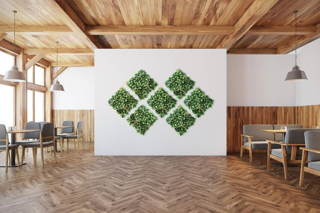 Lush artificial plant wall grass panels in a modern cafe setting, enhancing decor with greenery and elegance.