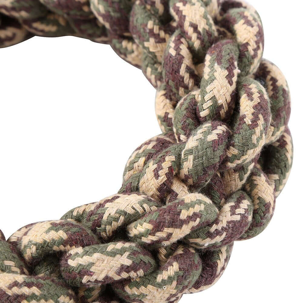 Durable cotton rope braided ring dog toy in assorted camouflage colors, perfect for chewing and tugging.