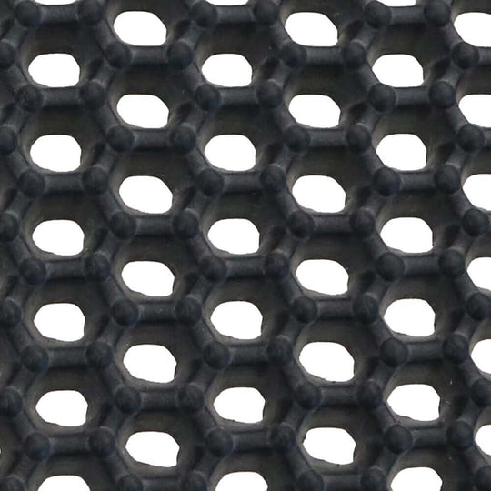 Close-up of honeycomb pattern on affordable waterproof cat litter trap mat for effective litter control.