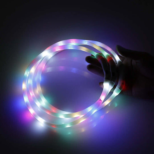 Colorful LED light strip being held, perfect for DIY projects and decor enhancement.