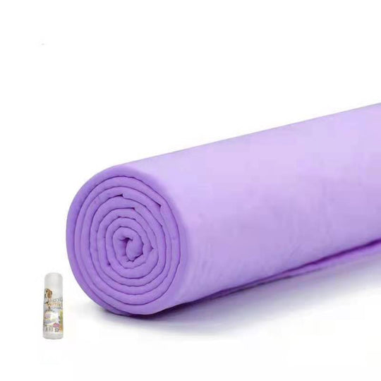 Rolled purple towel with a spray bottle, ideal for pet bathing and drying. Affordable, quality, and quick-dry design.