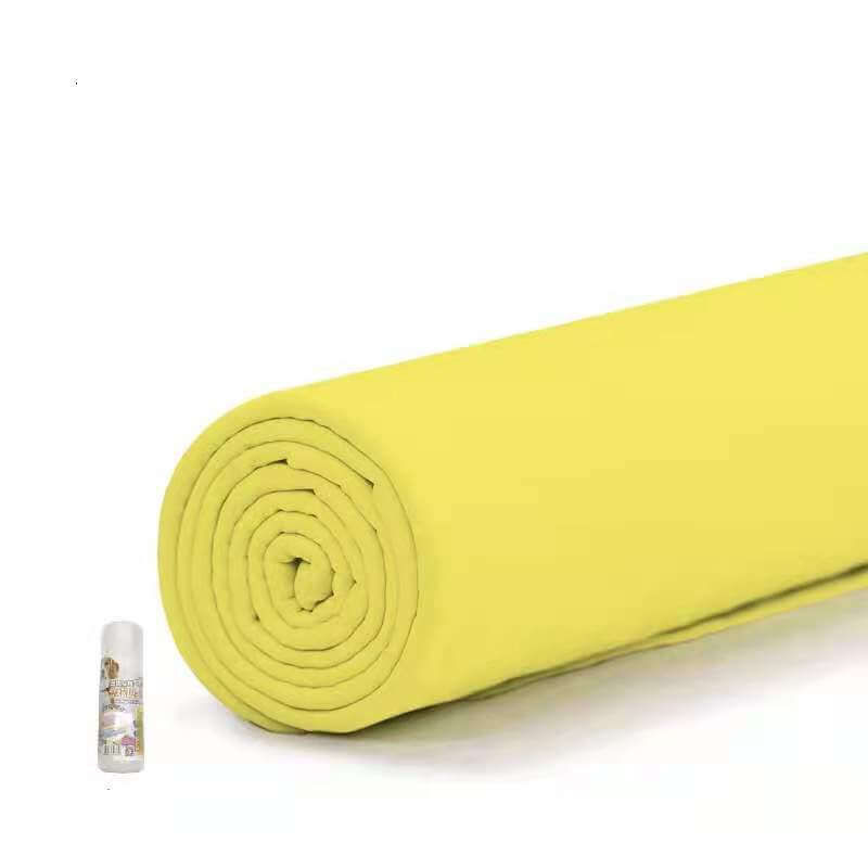 Rolled yellow pet towel next to a small spray bottle, showcasing a durable and absorbent design for pets.