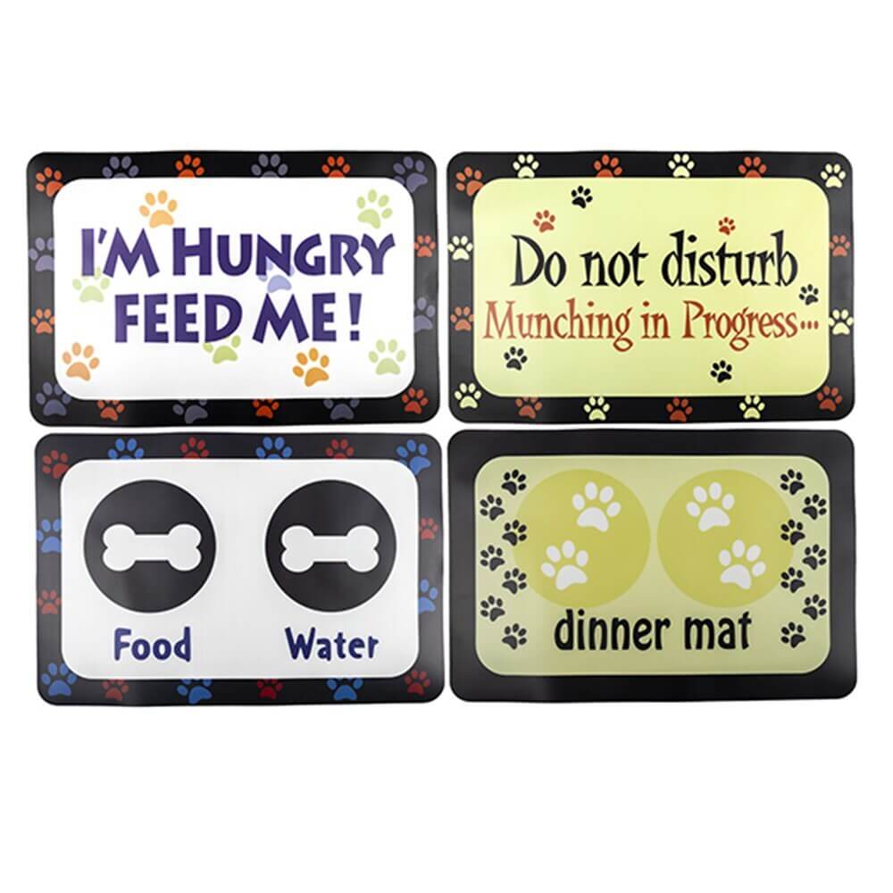 Four pet feeding mats with funny phrases and paw print designs for food and water placement.