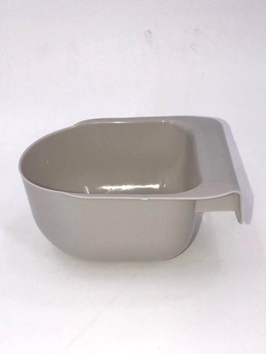 Gray plastic scoop for pet food storage container, durable and convenient for measuring dog food.