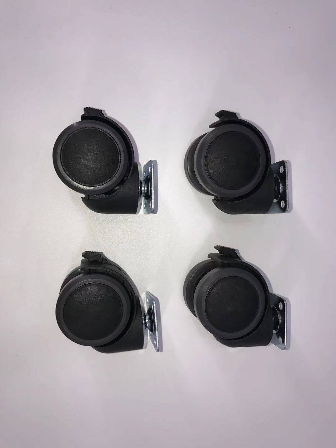 Set of four black swivel casters with metal brackets for easy mobility on furniture or DIY projects.