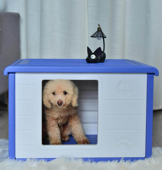 Small blue plastic pet house with a cute dog inside, designed for comfort and ventilation, perfect for furry friends.