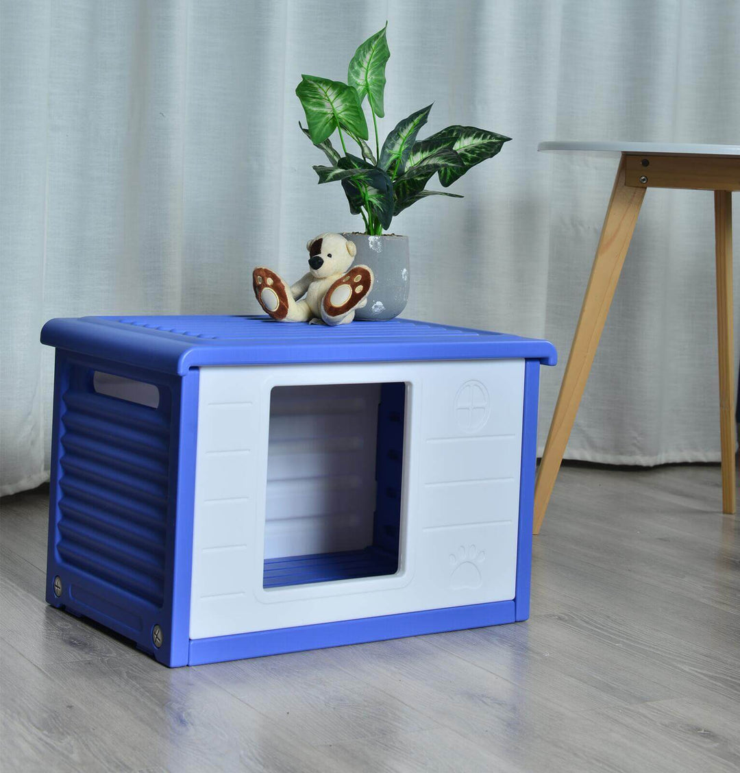 Small blue plastic pet house kennel for dogs and cats with ventilation and raised floor, suitable for pets up to 15 kg.