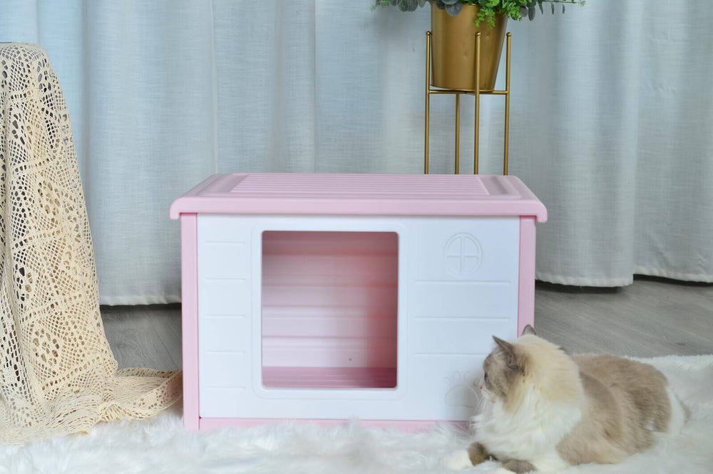 Pink plastic pet house for small dogs and cats, providing comfort and ventilation, ideal for pets up to 15 kg.