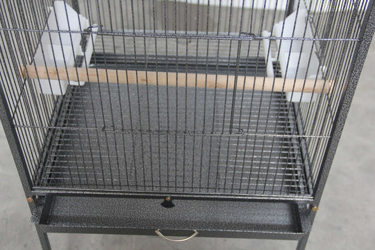 Interior view of YES4PETS large bird cage with wooden perch and removable tray for easy cleaning.