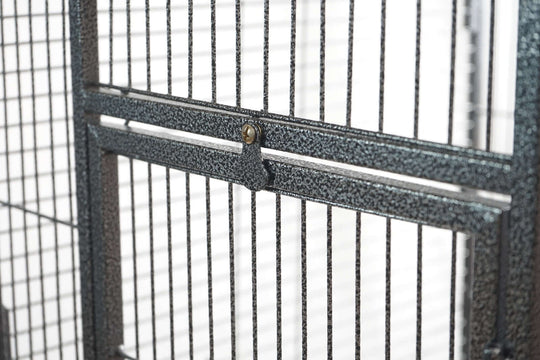 Close-up of the sturdy metal door latch on the YES4PETS large bird cage, designed for easy access and secure locking.