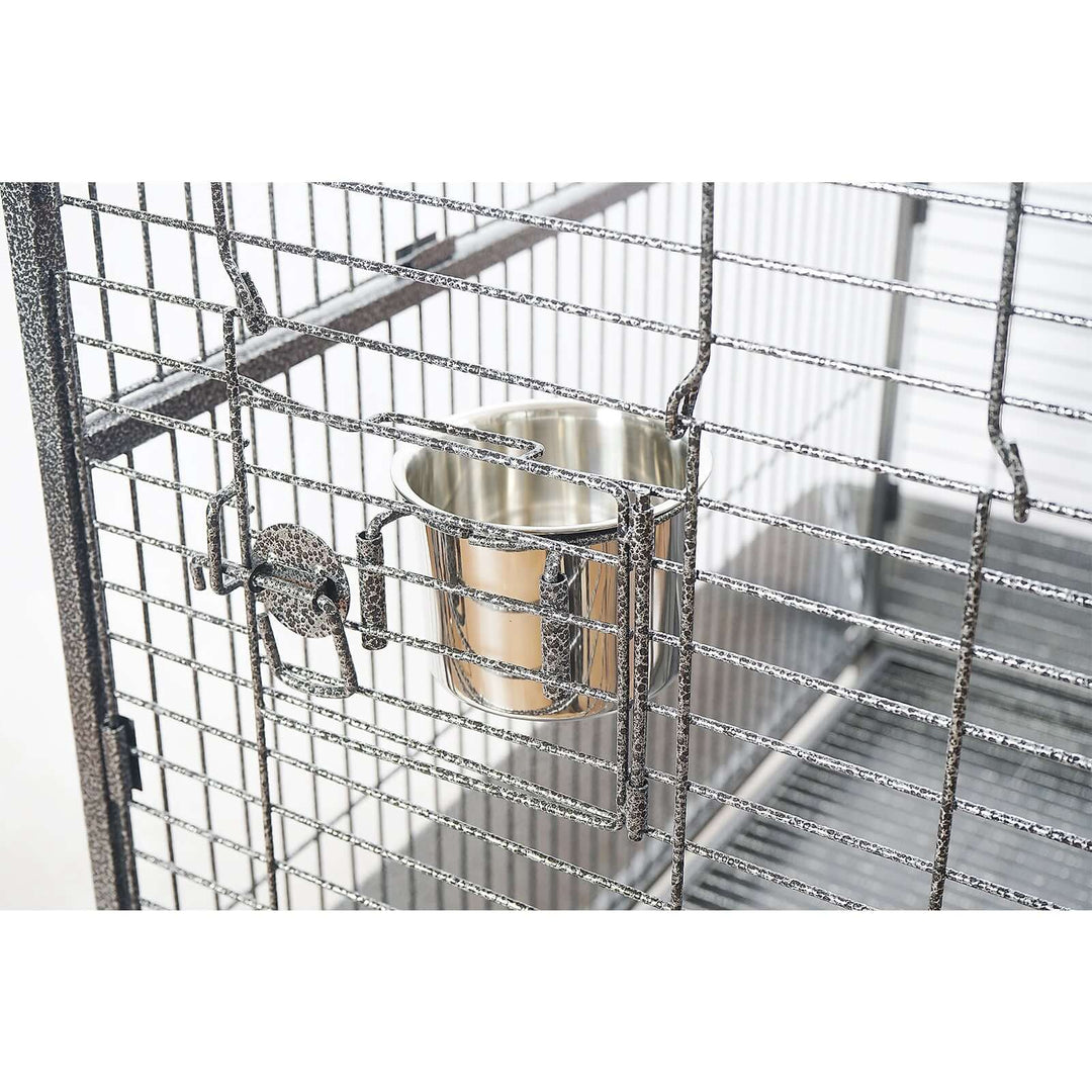 Close-up of YES4PETS XL bird cage showing stainless steel feeder and secure latch for medium and large parrots.