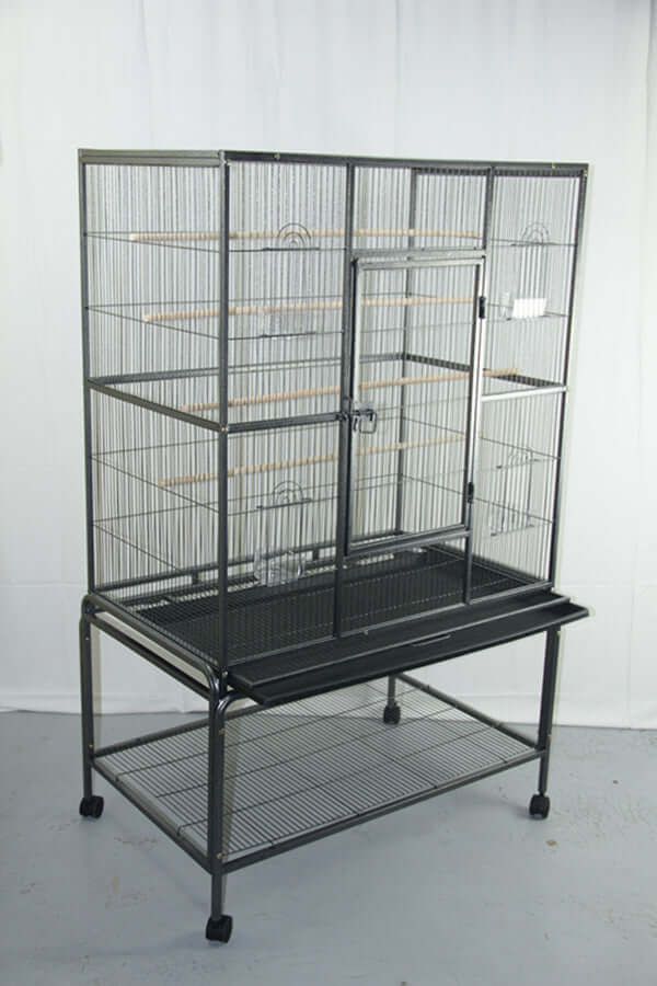 Large bird cage aviary for parrots and budgies with wooden perches on sturdy stand and castor wheels.