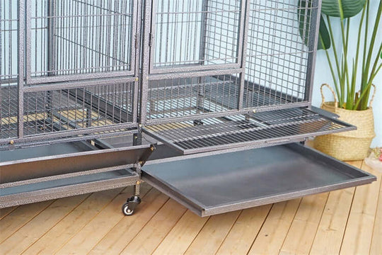 Close-up of YES4PETS XXXL bird cage showing removable tray and castor wheels for easy cleaning and mobility.