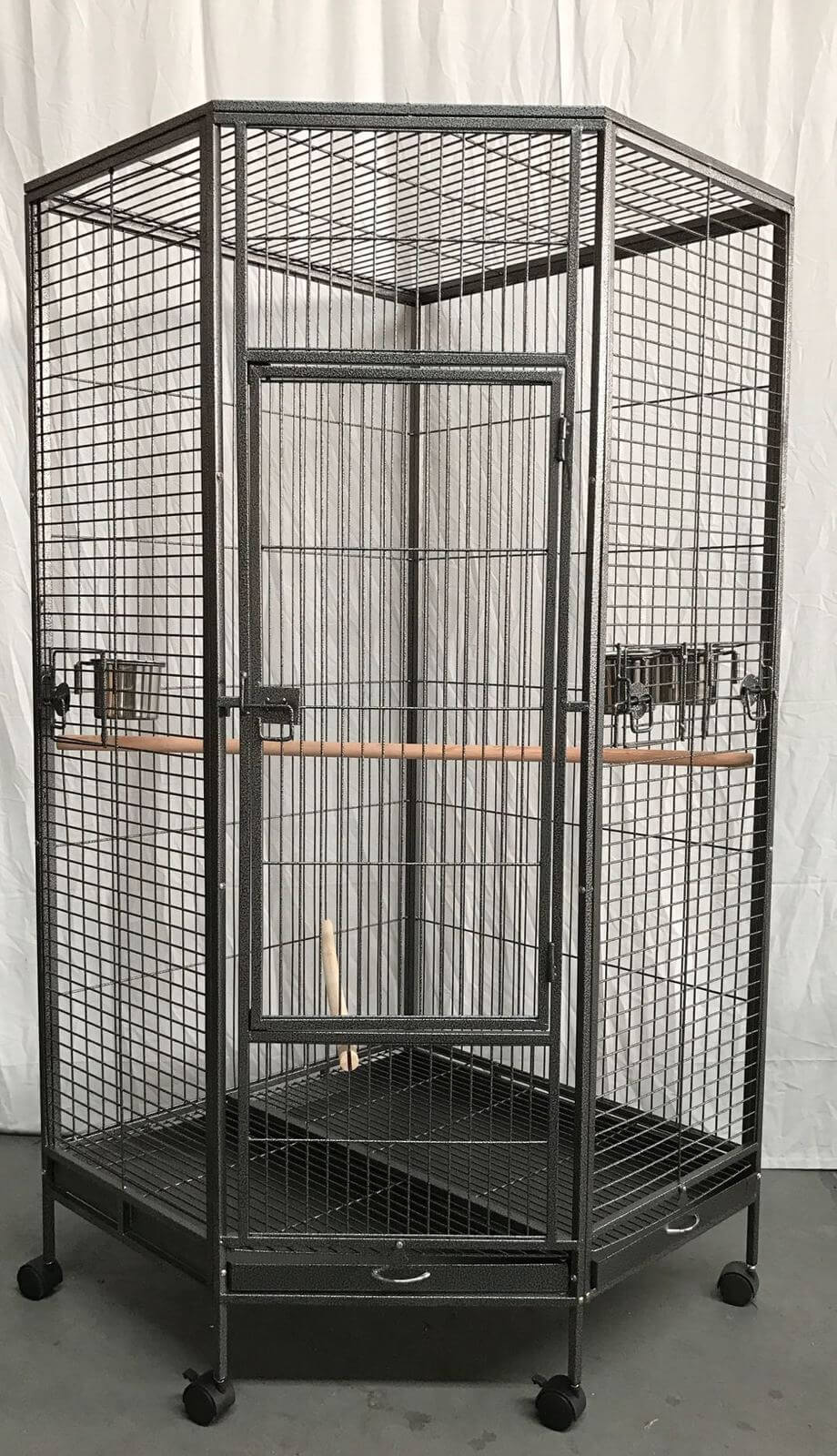 Large corner bird cage for parrots with castor wheels and wooden perch, durable and eco-friendly design.