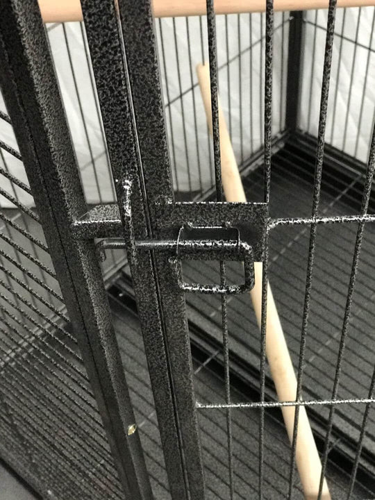 Close-up of YES4PETS bird cage lock and interior perch, showcasing quality and durability for pet safety.