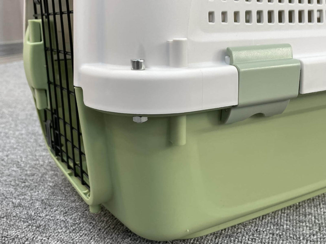 Close-up of YES4PETS green pet carrier showcasing its durable design and secure latches for small dogs and cats.