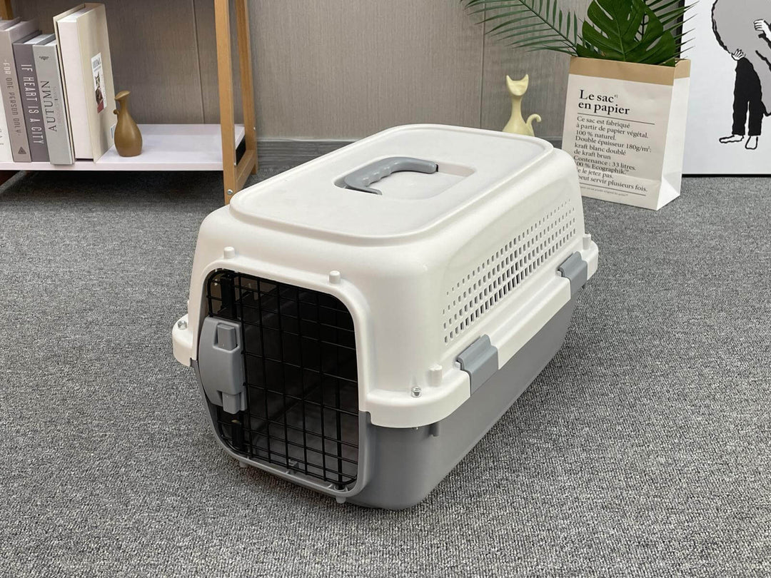 Affordable medium pet carrier for dogs, cats, and rabbits with ergonomic handle and ventilation slots.