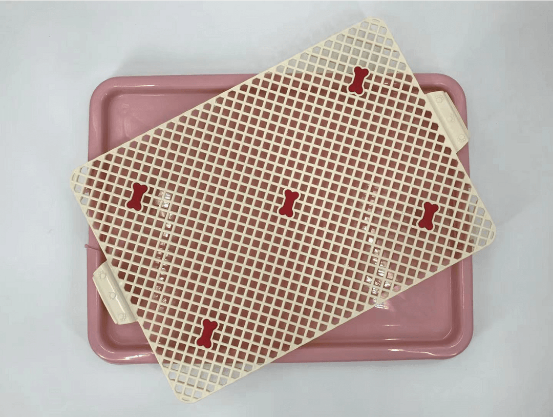 YES4PETS portable dog potty training tray mat in pink with a removable grid layer for easy waste disposal.