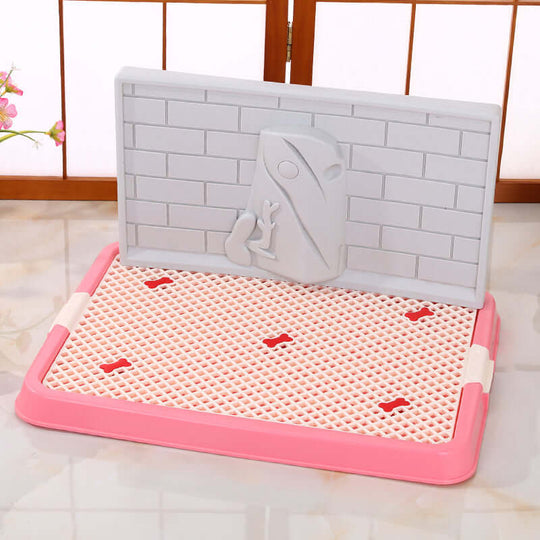 Pink portable dog potty training tray with a protective wall and grid for easy cleaning, ideal for puppies.