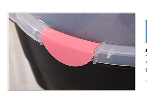 Close-up of a pink lid clip on a black pet carrier, showcasing its quality and affordable design.