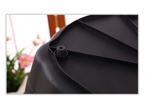 Close-up of a black container top showing textured surface and ventilation feature, ideal for DIY projects.