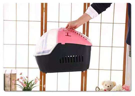 Lightweight pink and black portable pet carrier for small dogs or cats, perfect for travel with ergonomic handle.