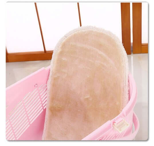 Cozy beige mat inside a pink pet carrier for small dogs and cats, ensuring comfort and support during travel.