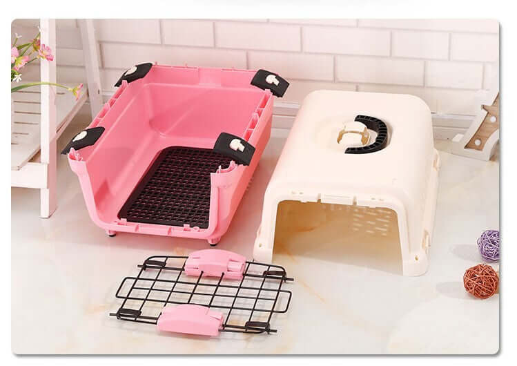 Small portable pink and white plastic pet carrier with tray, affordable and quality travel cage for cats and dogs.