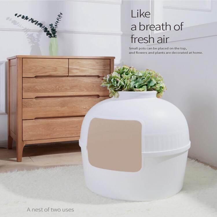 Multifunctional semi-enclosed cat litter box shaped like a clay pot, blending seamlessly with home decor.