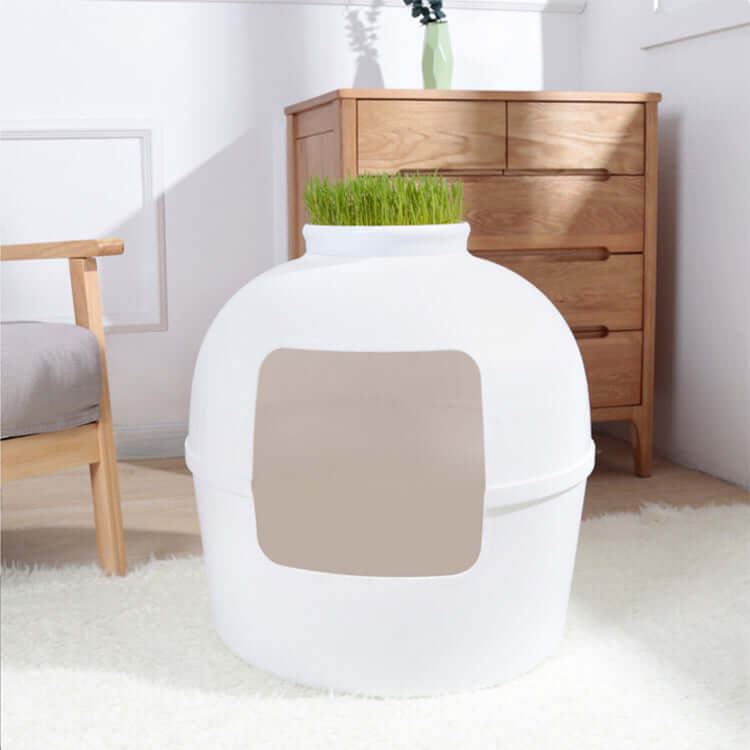 Multifunctional semi-enclosed white cat litter box resembling clay pot, designed for quality and affordability in pet care.