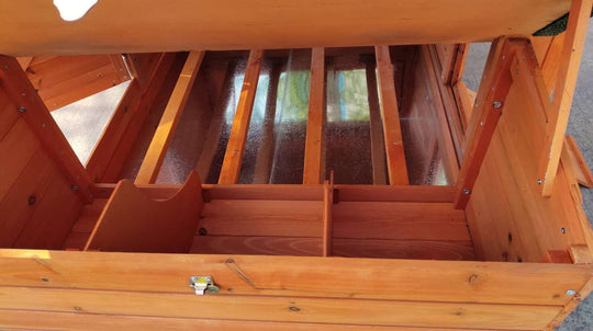 Interior view of YES4PETS XL Chicken Coop with nesting boxes and wooden dividers for optimal space organization.