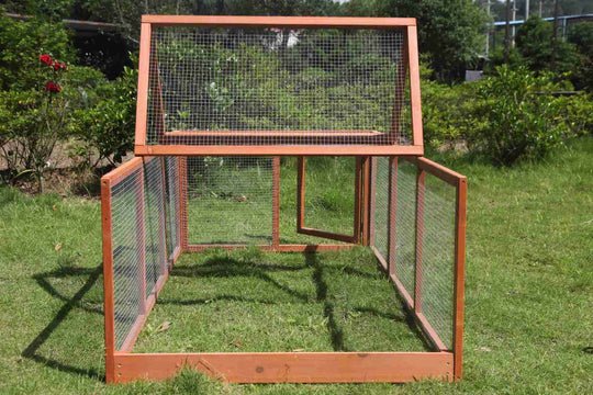 Large wooden chicken coop run and rabbit hutch with mesh wire, perfect for outdoor pet housing.