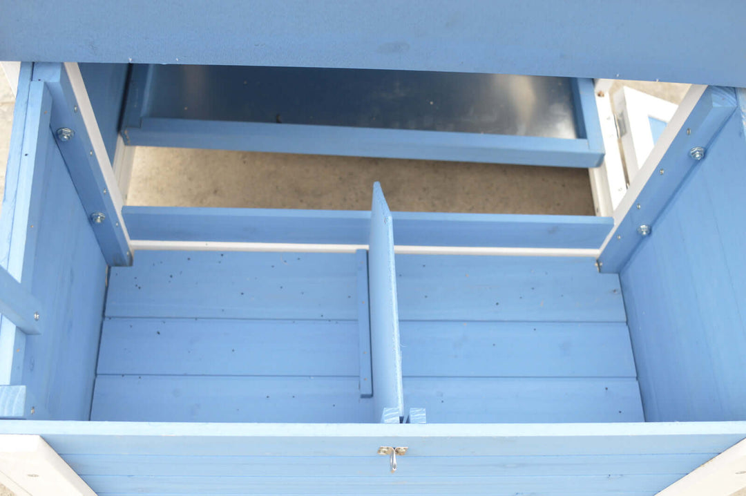 Inside view of the blue Chicken Coop Rabbit Hutch, showcasing divided space for organization and easy cleaning.